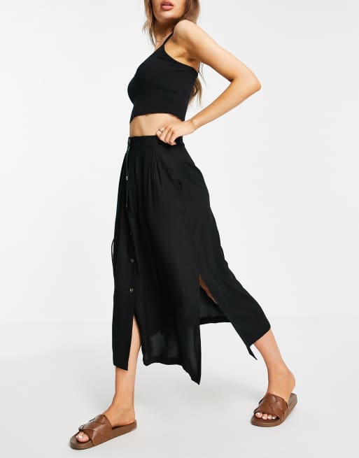 Falda midi negra con profundos botones ASOS DESIGN | ASOS