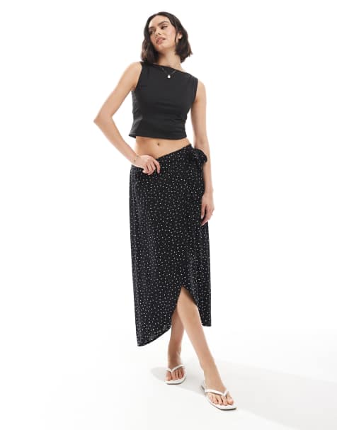Falda midi negra cruzada con estampado de lunares de Pieces - view 1