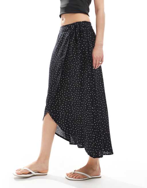Falda midi negra cruzada con estampado de lunares de Pieces, 2 de 4