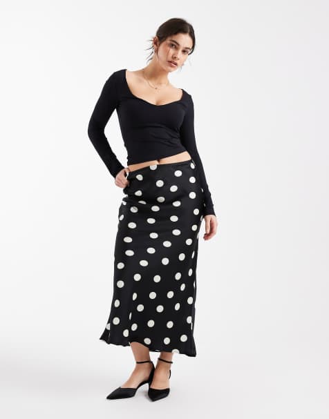 Falda midi negra de corte al bies con estampado de lunares de New Look - view 1