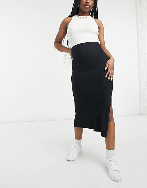 Falda midi negra combinación de punto cortada al bies con detalle abertura de | ASOS