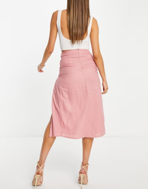 Falda midi rosa pálido caída, botones en el lateral y abertura hasta el muslo de ASOS DESIGN | ASOS