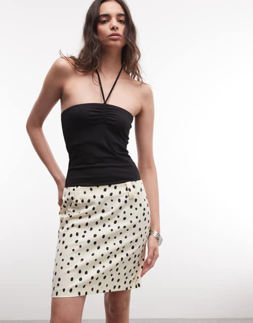 Falda por la rodilla color limón de talle bajo con estampado de lunares de Monki