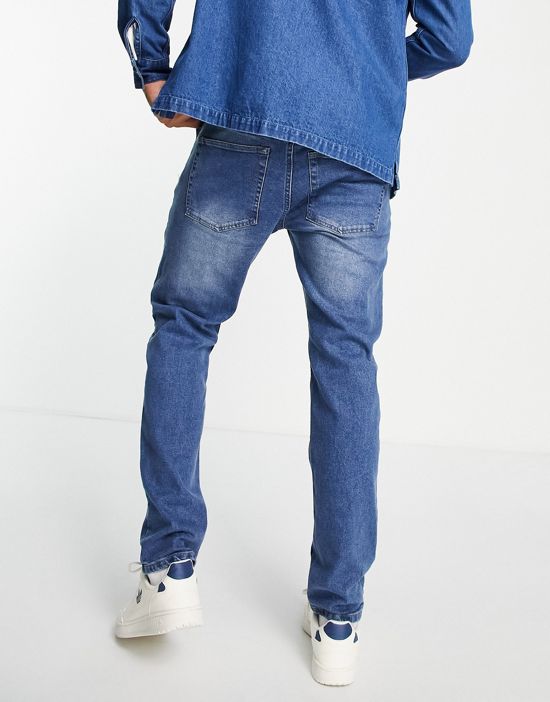 https://images.asos-media.com/products/farah-elm-stretch-slim-jeans-in-mid-wash/201574283-4?$n_550w$&wid=550&fit=constrain