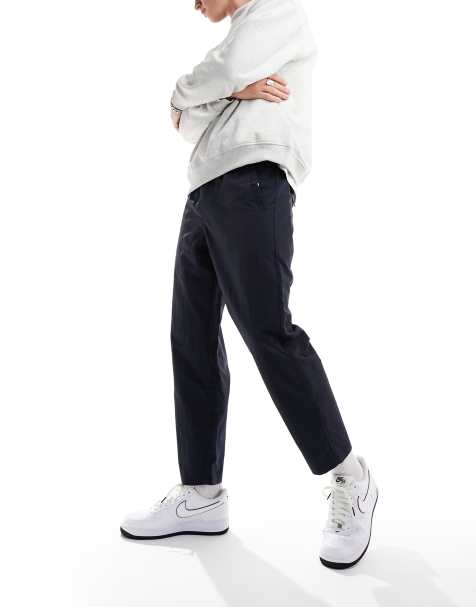 Farah - Hawtin - Ruimvallende technische toelopende broek in marineblauw - view 1