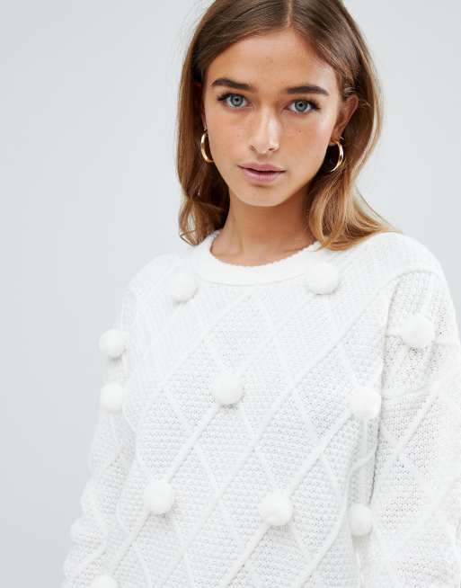 White sweater shop with pom poms