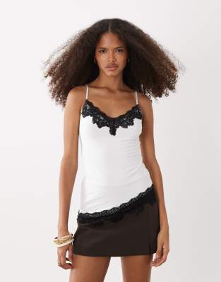 Fashionkilla Exclusive Slinky Contrast Lace Trim Asymmetric Hem Cami Top In White