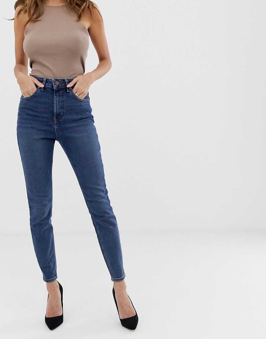 Faste skinny jeans med superhøj talje i forvasket mellemblå stonewash fremstillet af genanvendte materialer fra ASOS DESIGN