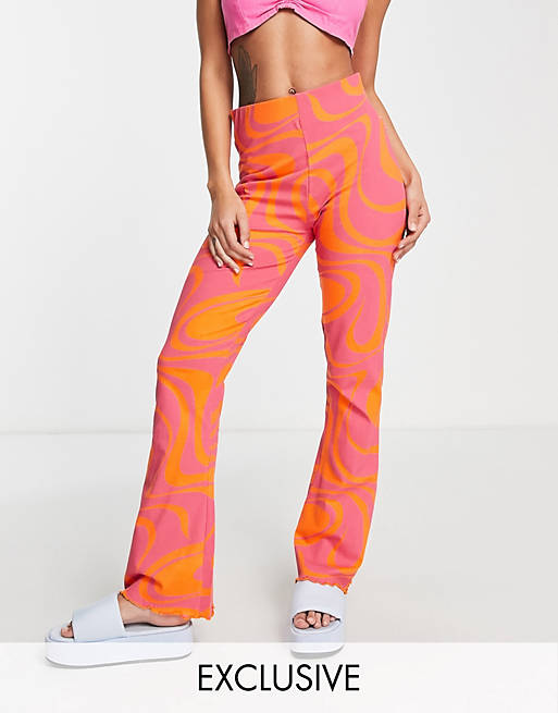 Fila - Flare-broek met wervelende print in roze