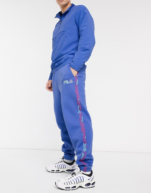 Fila Oscapon sweat pant with logo taping in blue exclusive at ASOS