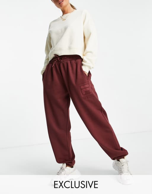 Fila oversized trackies with tonal branding in red