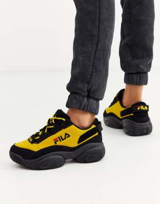 fila black and yellow sneakers