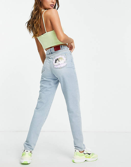 Fiorucci high waisted mom jeans with seashell angel bum graphic