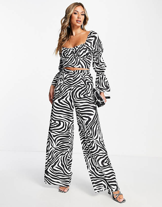 First Distraction - the label high waisted satin wide leg trouser co-ord in zebra print
