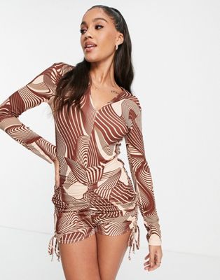 First Distraction the label ruched mini romper in brown swirl print