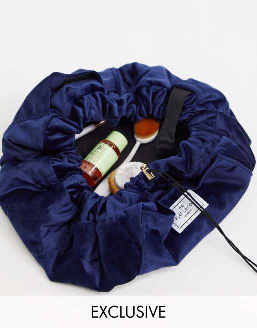 Flat Lay Co drawstring make up bag in blue velvet