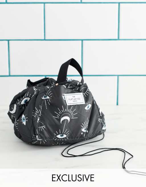 Flat Lay Co drawstring make up bag in cosmic eye print | ASOS