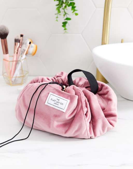 Flat Lay Co drawstring make up bag in pink velvet ASOS