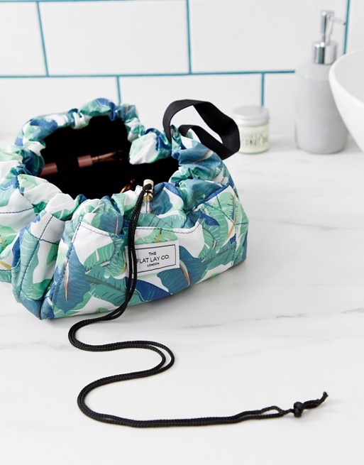 Flat Lay Co drawstring make up bag in Tropical Leaves