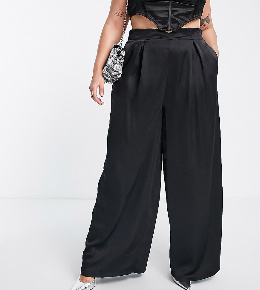 Plus-size trousers by Flounce London The scroll is over High rise Side pockets Pleat details Zip-back fastening Wide leg
