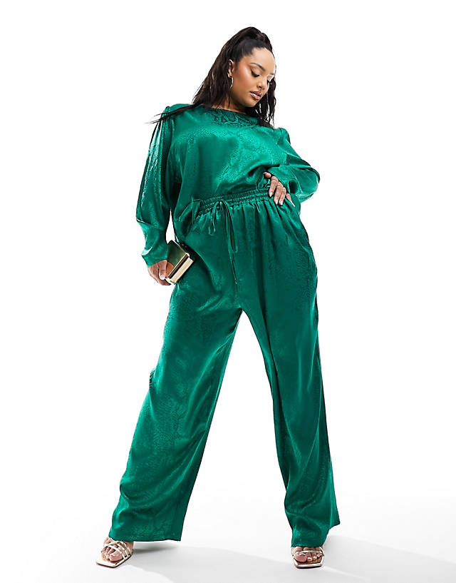 Flounce London Plus - satin floaty trousers in emerald green co ord
