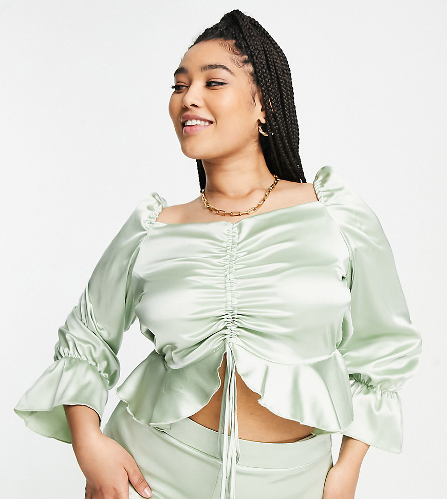 Plus-size blouse by Flounce London Introduce it to your other nice tops Square neck Long sleeves Adjustable ruched front Frill trims Regular fit