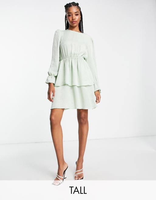 Flounce London Tall satin tiered mini dress in sage, jordyn woods dress  tights hot pink heels lucky daye over