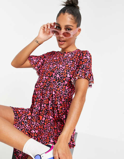 Flounce London - Vestito grembiule con maniche con volant e stampa a cuori