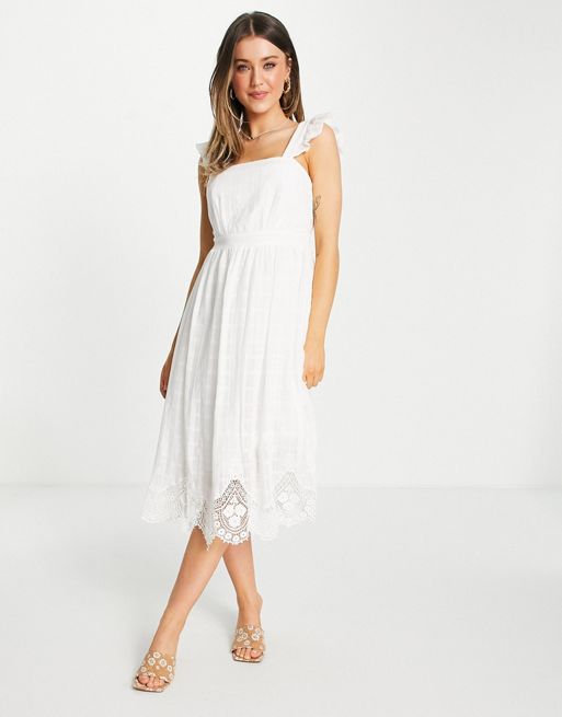 Forever New – Biała koronkowa sukienka midi z wycięciem na plecach,  kokardką i falbanką na ramionach | ASOS