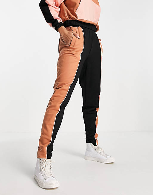 Fred Perry colour block trackies in black and orange