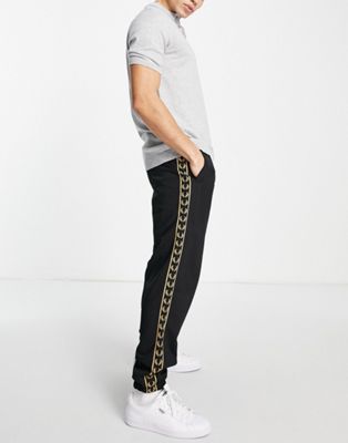 Fred Perry gold taped track joggers in black