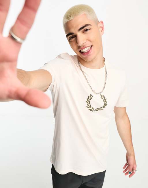 Maluma, wearing a black Off-White printed t-shirt, white sporty