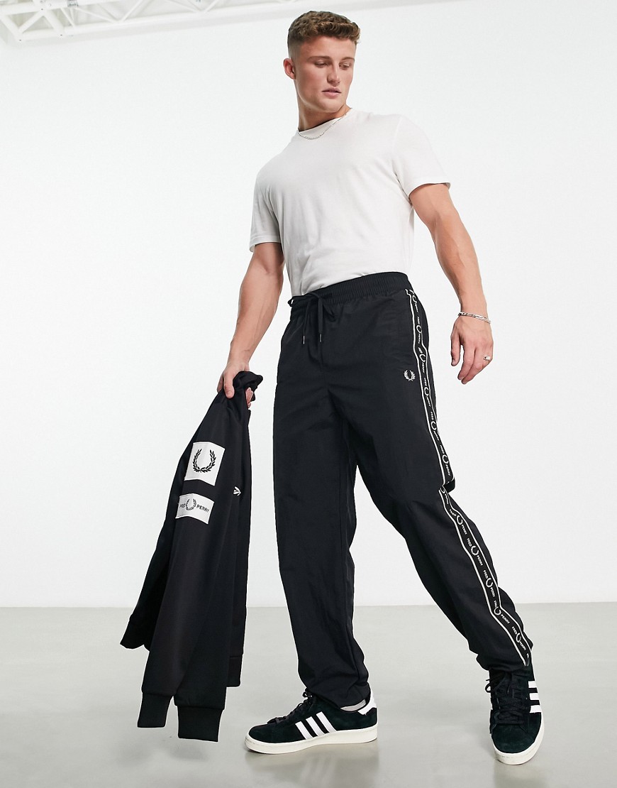 Fred Perry side taping shell joggers in black
