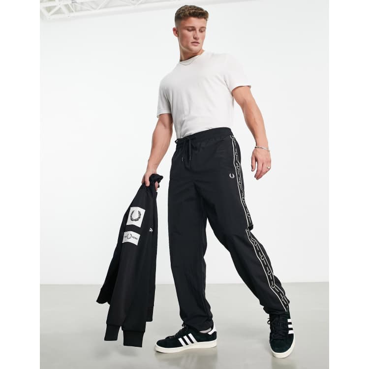 Fred Perry side taping shell sweatpants in black