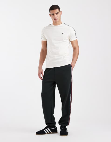 Fred Perry stripe tape logo track pants in dark green - view 1