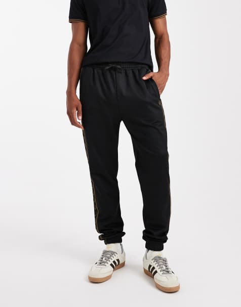 Fred Perry tape trackies in black - view 1