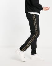 Fred Perry taped track pants in black