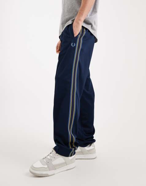 Fred Perry Tramline tape logo track pants in blue - view 1