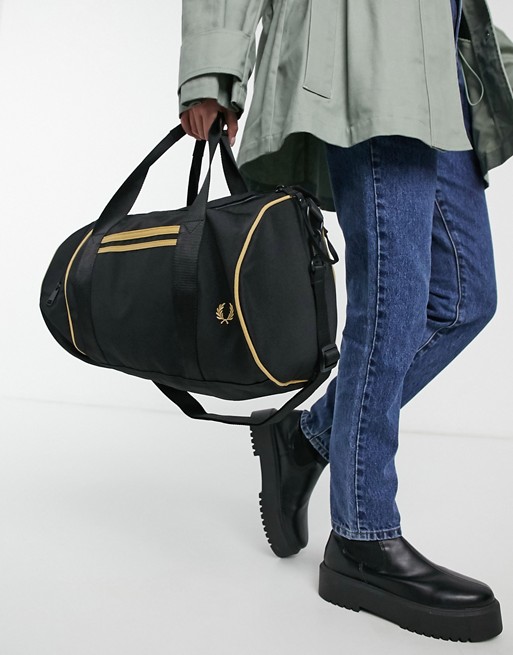 Fred Perry twin tipped barrel bag in black and gold