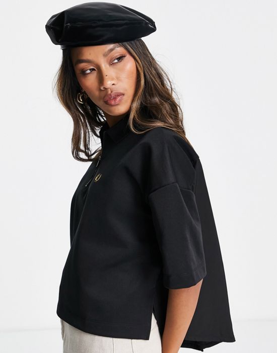 https://images.asos-media.com/products/fred-perry-woven-panel-polo-shirt-in-black/201655717-1-black?$n_550w$&wid=550&fit=constrain