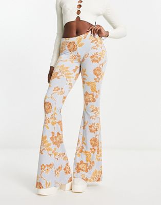 Free People bloom floral slinky flared trousers in light blue