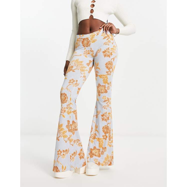 Free People bloom floral slinky flared trousers in light blue