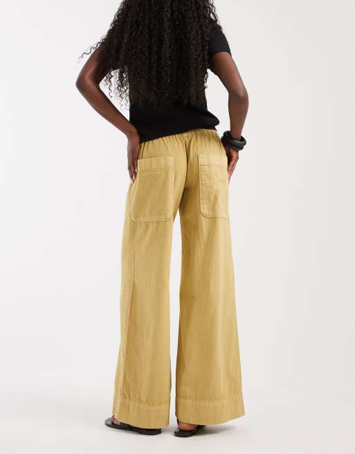 Free People breezy low rise flare pull on trouser in mustard, 3 of 5