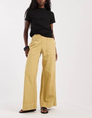 Free People Breezy Low Rise Flared Pull-on Pants In Yellow