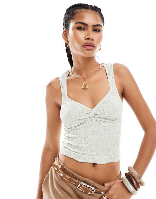 Free People - Canottiera testurizzata in pizzo color acqua con scollo a cuore