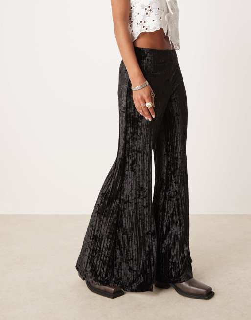 Free People crinkle velvet pleated wide leg pants in black | ASOS