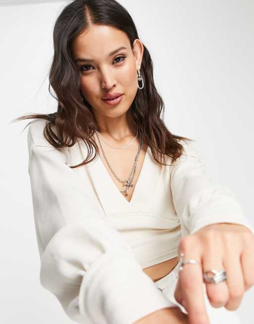 Free People - Cropped trui met lange mouwen en V-hals van ivoorwitte wafelstof