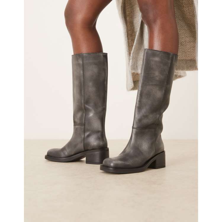 Free People Dana distressed leather pull-on boots in black | ASOS