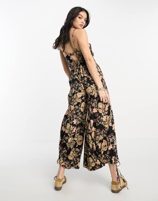 https://images.asos-media.com/products/free-people-floral-ankle-tie-detail-jumpsuit-in-black/204664114-4?$n_640w$&wid=513&fit=constrain