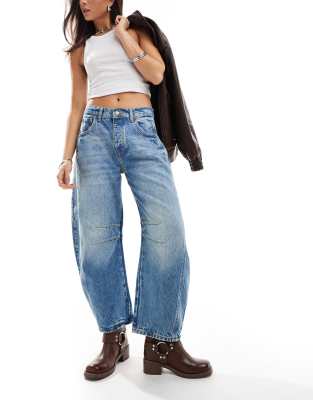 Free People - Good Luck - Jeans in mittelblauer Waschung mit weitem Bein und mittelhohem Bund